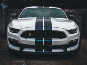 Detailed close-up of a classic Ford Mustang showcasing its front grille and iconic design.